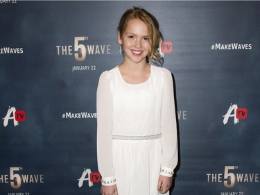 Actor Tabitha Bateman attends "The 5th Wave" premiere at the Pacific Theatres at The Grove in Los Angeles, California, January 14, 2016.