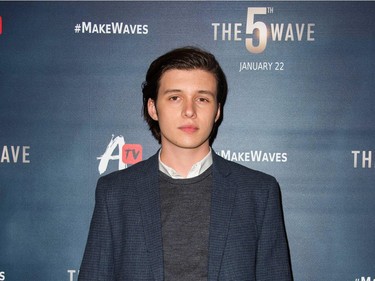 Actor Nick Robinson attends "The 5th Wave" premiere at the Pacific Theatres at The Grove in Los Angeles, California, January 14, 2016.