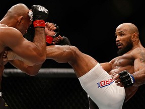 Yoel Romero of Cuba kicks Ronaldo 'Jacare' Souza of Brazil in their middleweight bout during the UFC 194 event inside MGM Grand Garden Arena on December 12, 2015 in Las Vegas, Nevada.
