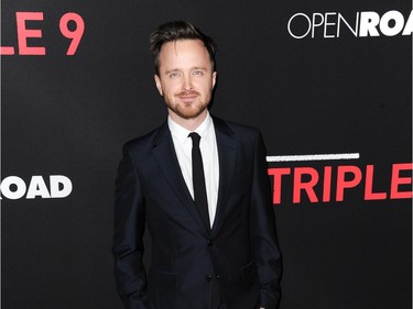Actor Aaron Paul arrives at the LA premiere of "Triple 9" at the Regal Theater LA Live on February 16, 2016, in Los Angeles, California.