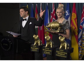 Canadian Taxpayers Federation Federal Director Aaron Wudrick gestures to the winners of the 18th annual Teddy Government Waste awards during a news conference on Parliament Hill, Wednesday February 24, 2016 in Ottawa.