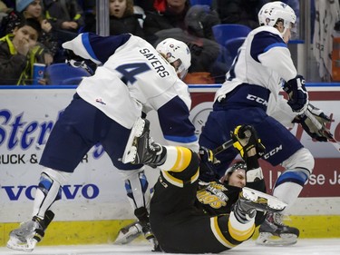 The lower bowl in SaskTel Centre was packed in the morning on February 22, 2016 as schoolchildren made up the audience in a rare day game for the Saskatoon Blades against the Brandon What Kings. Blades Bryton Sayers and Ryan Graham rub out Wheat Kings' Jayce Hawrykuk.