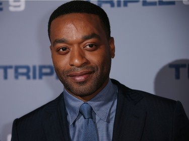 Actor Chiwetel Ejiofor poses for photographers upon arrival at the premiere of "Triple 9" in London, England, February 9, 2016.