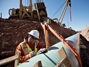 A weld inspector  fills out paperwork during construction of the Gulf Coast Project pipeline, on March 11, 2013.