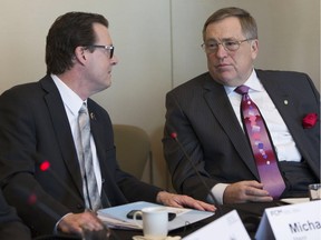 Regina mayor Michael Fougere, left, and Saskatoon mayor Don Atchison, attend the Big Cities Summit in Toronto on Thursday, February 5, 2015.