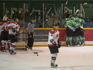 The University of Saskatchewan Huskies celebrate a goal against the University of Calgary Dinos in CIS Men's Hockey playoff action at Rutherford rink on the U of S campus on Saturday, February 27th, 2016.