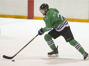 University of Saskatchewan Huskies defenceman Kendall McFaull moves the puck against the University of Calgary Dinos in CIS Men's Hockey playoff action at Rutherford rink on the U of S campus on Saturday, February 27th, 2016.