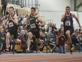 University of Saskatchewan Huskies Jared Olson, left, and Winston Williams race during the Canada West Track and Field championships at the field house on the U of S campus on Saturday, Feb. 27, 2016.