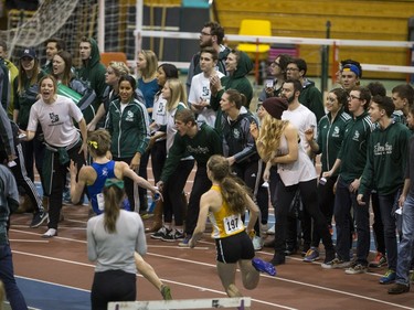 University of Saskatchewan Huskies teammates cheer on their racer during the Canada West Track and Field championships at the field house on the U of S campus on Saturday, February 27th, 2016.