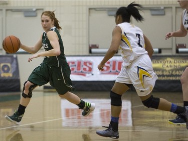 University of Saskatchewan Huskies guard Kelsey Trulsrud moves the ball against the University of Brandon Bobcats in CIS Women's Basketball action, February 6, 2016.