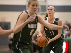 University of Saskatchewan Huskies guard Laura Dally moves the ball against the University of Alberta Pandas in CIS women's basketball action, Feb. 13, 2016. The Huskies and Pandas will meet again Friday in Canada West semifinal action.