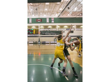 University of Saskatchewan Huskies forward Dalyce Emmerson attempts to take a shot against the University of Alberta Pandas in CIS Women's Basketball action, February 13, 2016.
