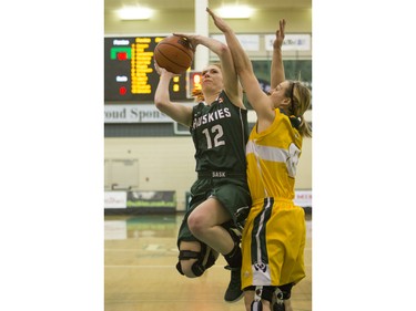 University of Saskatchewan Huskies guard Kelsey Trulsrud pushes through a lay up against the University of Alberta Pandas in CIS Women's Basketball action, February 13, 2016.