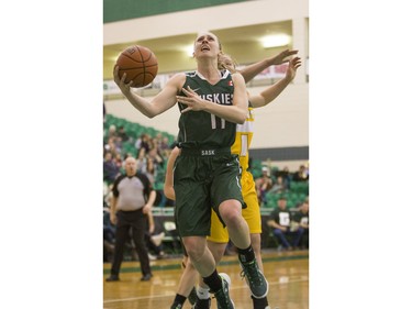 University of Saskatchewan Huskies guard Laura Dally goes in for a lay up against the University of Alberta Pandas in CIS Women's Basketball action, February 13, 2016.
