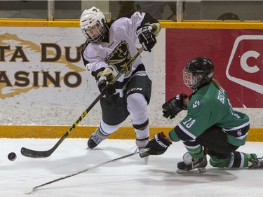 University of Saskatchewan Huskies forward Kori Herner attempts to block pass from the University of Manitoba Bisons forward Lauryn Keen in CIS Women's Hockey action, February 20, 2016.