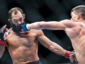 Welterweight Johny Hendricks takes a shot to the chin from Stephen Thompson during their UFC Fight Night 82 bout at the MGM Grand Garden Arena in Las Vegas on Saturday, Feb. 6, 2016