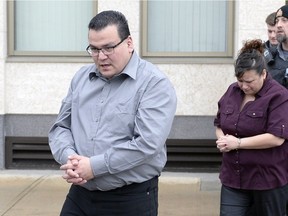 Kevin Goforth, left, and Tammy Goforth, right, are led away from the Court of Queen's Bench in Regina on Feb. 6, 2016.