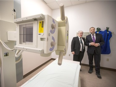 NDP Leader Tom Mulcair (R) is shown the X-ray area of the La Loche Community Health Centre while given a tour from Jean-Marc Desmeules CEO of the Keewatin Yatthe Regional Health Authority on February 2, 2016.