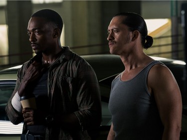 Anthony Mackie (L) and Clifton Colins Jr. star in "Triple 9."