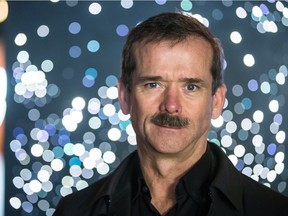 Canadian astronaut Chris Hadfield poses for a photograph at the Montreal planetarium in Montreal on Thursday, November 20, 2014.