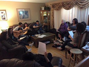 Musicians, including members from Voices of the North, can be seen inside of a home in Prince Albert on Jan. 28, 2016 after recording a rendition of Lean on Me as a tribute to the victims of the La Loche shooting tragedy. Organizers and producers say the music community in Northern Saskatchewan is extremely tight and they wanted to express their support and condolence for the community through song.