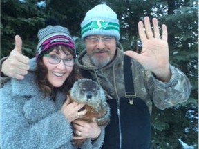 Saskatchewan's unofficial groundhog, Whelan Woody, is forecasting an early spring and a better season for the Saskatchewan Roughriders. He's accompanied by his handler Shanno Lidster and unofficial Whelan Mayor Dave Hansen. Photo courtesy Shanno Lidster