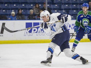 Saskatoon Blades defenceman Jake Kustra takes a shot against he Swift Current Broncos in WHL action  on Saturday, February 6th, 2016.