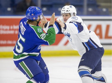 A fight between Swift Current Broncos forward Arthur Miller and Saskatoon Blades forward Cameron Hausinger in WHL action  on Saturday, February 6th, 2016.