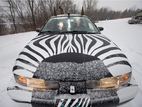 Mark and Moira Willems pose for a photograph with their zebra car on February 13, 2016.