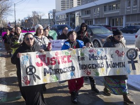 Connie Beauchene, left, walks during a march for missing and murdered indigenous women on Sunday, Feb. 14, 2016.