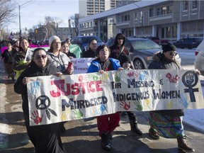 Connie Beauchene (L) walks during a march for missing and murdered indigenous women, February 14, 2016.