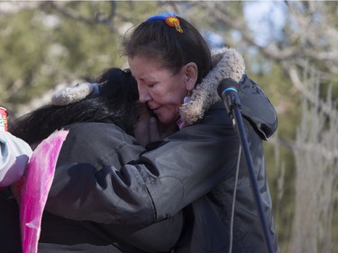 Lori Nicotine, right, hugs Connie Beauchene after she finishes speaking at city hall prior to going on a walk for missing and murdered indigenous women on Sunday, February 14th, 2016.