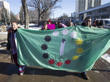 Lori Nicotine, left, walks during a march for missing and murdered indigenous women on Sunday, February 14th, 2016.