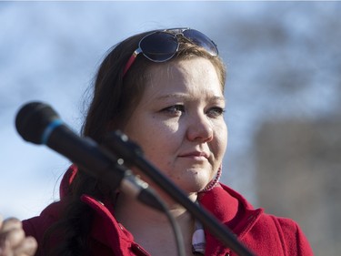 Nicole Yamchuk listens to speakers at city hall prior to going on a walk for missing and murdered indigenous women on Sunday, February 14th, 2016.
