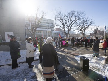 People gather and listen to speakers at city hall prior to going on a walk for missing and murdered indigenous women on Sunday, February 14th, 2016.