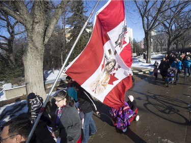 People walk during a march for missing and murdered indigenous women, February 14, 2016.