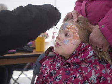 Kaitlin Benders, age 4, gets her face painted during the Family Day Skating Party at Meewasin Skating Rink on Monday, February 15th, 2016.