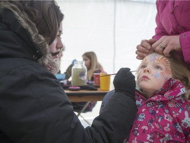 Four-year-old Kaitlin Benders gets her face painted by Taylor Mauice during the Family Day Skating Party at Meewasin Skating Rink, February 15, 2016.