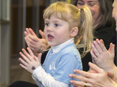 Maddie Smith and a group of parents all applaud PotashCorp's large donation to The Children's Discovery Museum, giving the donator the naming rights to the new and upcoming museum taking over the Mendel Art Gallery space, February 16, 2016.