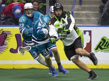 Saskatchewan Rush defence Kyle Rubisch makes a pass against the Rochester Knighthawks in NLL first half, February 19, 2016.