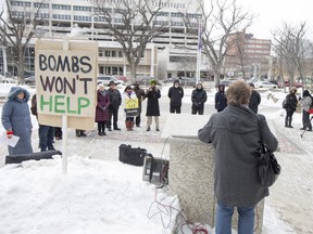 About two dozen people gathered outside Saskatoon City Hall Saturday to rally for peace in Syria.