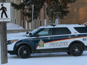 SASKATOON, SASK.; FEBRUARY 25, 2015 - 5 Saskatoon city police cars were stationed outside this apartment block at 2008 20th St. W. after reports of a early morning shooting, February 25,  2015 (GordWaldner/TheStarPhoenix)