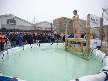A Polar Dipper jumps in to a small pool prior to the Polar Dip to fight human trafficking at the Farmers market on Saturday, February 27th, 2016.