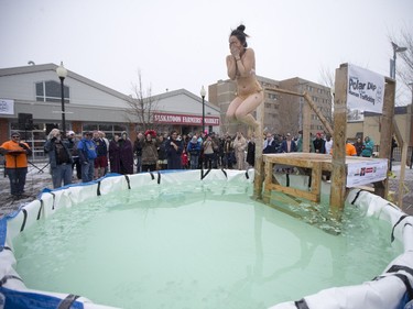 A Polar Dipper jumps in to a small pool prior to the Polar Dip to fight human trafficking at the Farmers market on Saturday, February 27th, 2016.