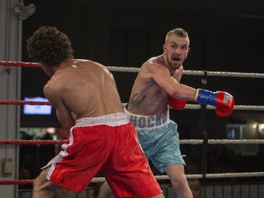 Justin Hacko, right, miss a punch on Wayne Smith during the At Last: Championship boxing at Prairieland Park on Saturday, February 27th, 2016.