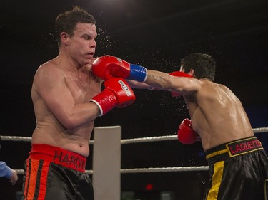 Noel Harding, left, exchanges punches with Lee Laquette during the At Last: Championship boxing at Prairieland Park on Saturday, February 27th, 2016.