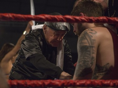 Paul Bzdel's, right, trainer talks to him between rounds against Shaklee Phinn during the main event of At Last: Championship boxing at Prairieland Park on Saturday, February 27th, 2016.