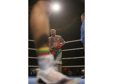 Paul Bzdel, right, recovers after a low blow as he takes on Shaklee Phinn during the main event of At Last: Championship boxing at Prairieland Park on Saturday, February 27th, 2016.