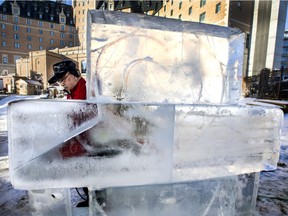 Ice sculptors work on their art at the Frosted Garden, part of the annual WinterShines festival.