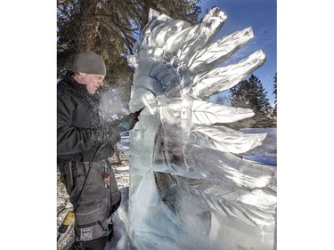 Saskatoon ice sculptor Doug Lingelbach works on an ice sculpture of a First Nation chief for the people of La Loche in WinterShines' Frosted Garden in the Bessborough Gardens area, January 27, 2016.